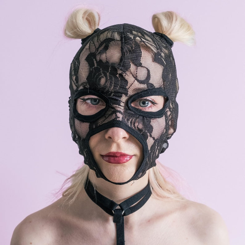 A handmade black mask with holes for letting hair through.76