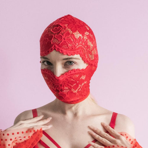 A handmade red mask, only revealing the eyes.75