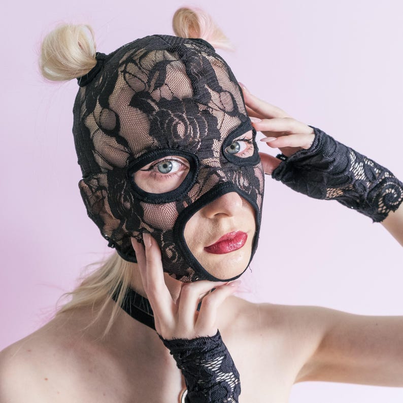 A handmade black mask with holes for letting hair through.76