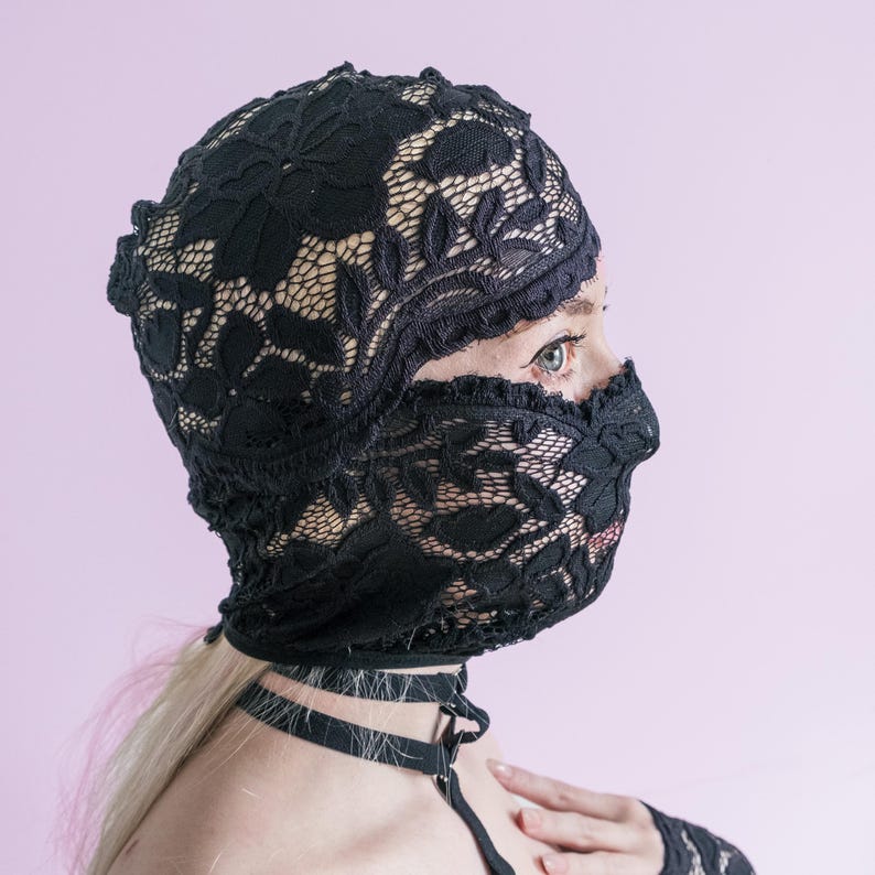 A handmade black mask that only reveals the eyes.74